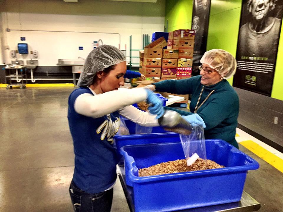 Volunteers packaging food
