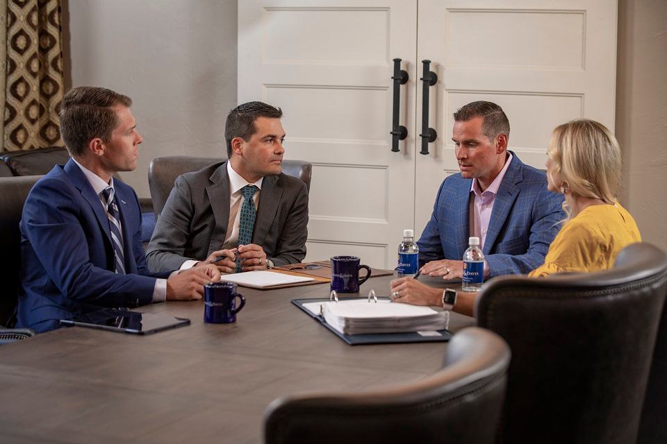 People around a table at a meeting